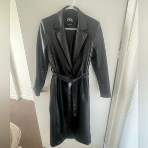 Long, black and pleather trench coat. Great in the rain.